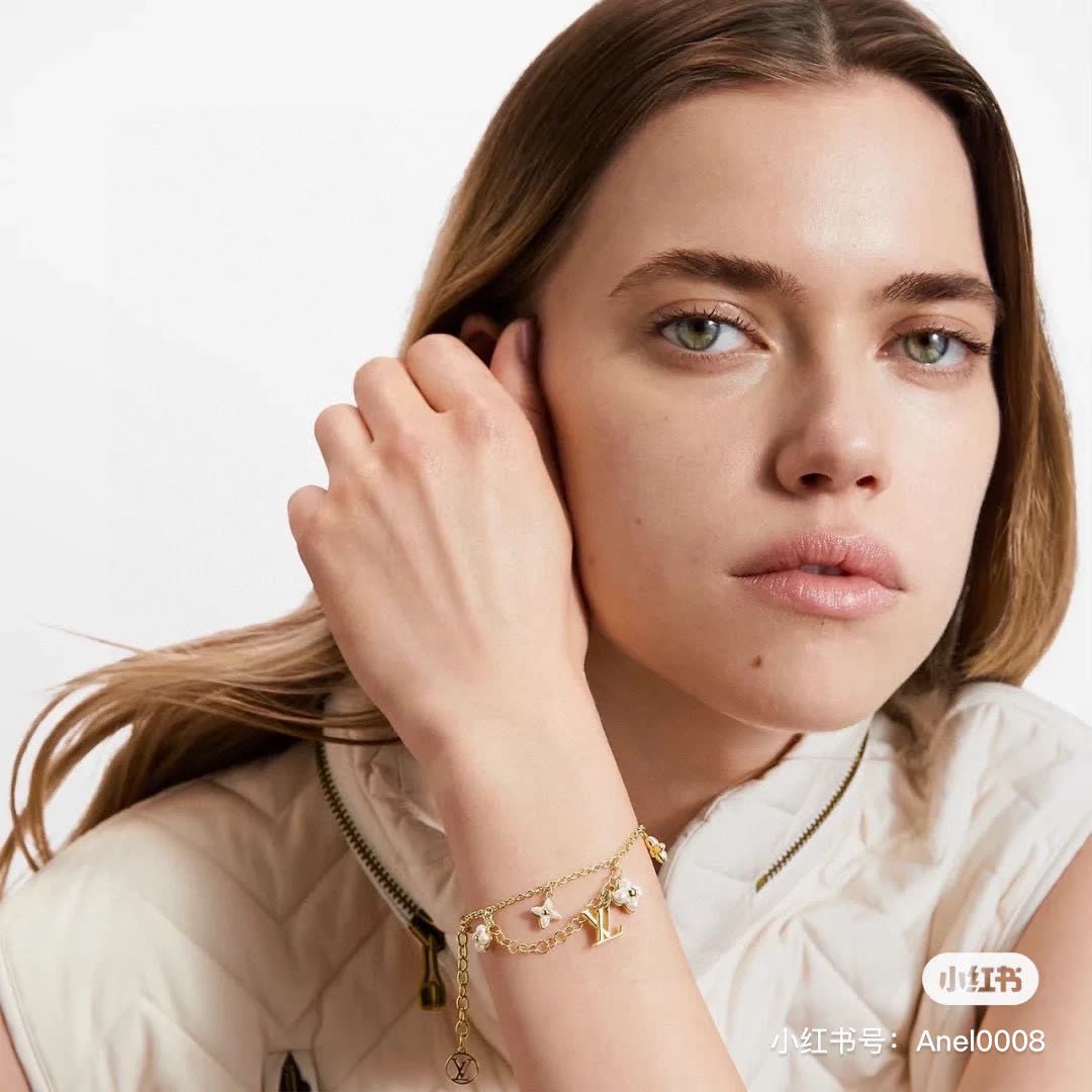 Louis Vuitton Gold Tone Bracelet with Pearls and Logo